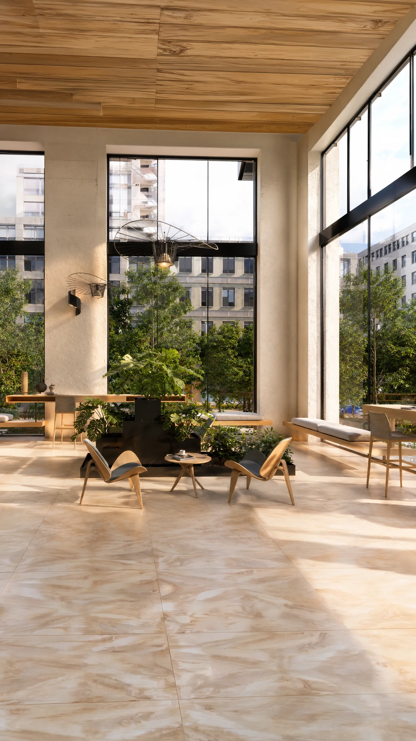 Área de coworking con vegetación junto a los ventanales